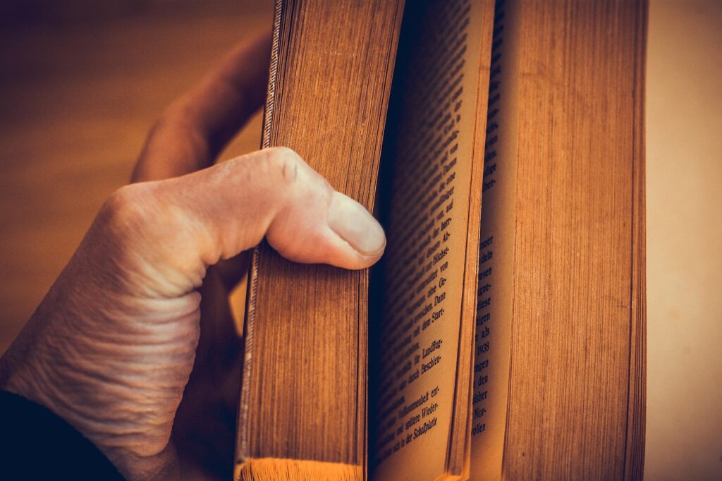 book, book pages, read, hand, keep, reading, story, pages